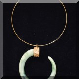 J16. Necklace with stone pendant.